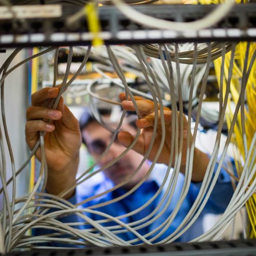 technician-fixing-cable-53FEWDW.jpg